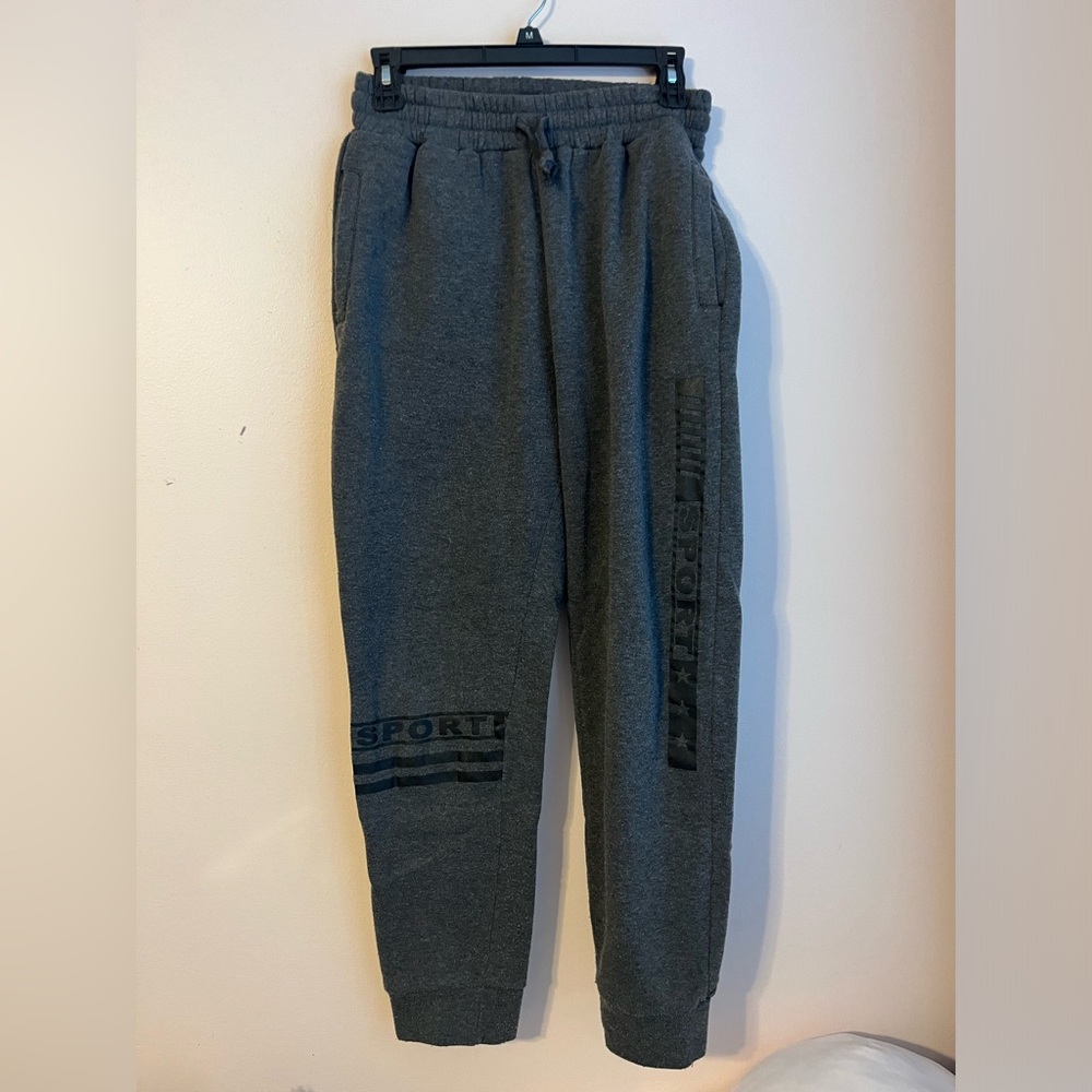 grey sweatpants with a graphic